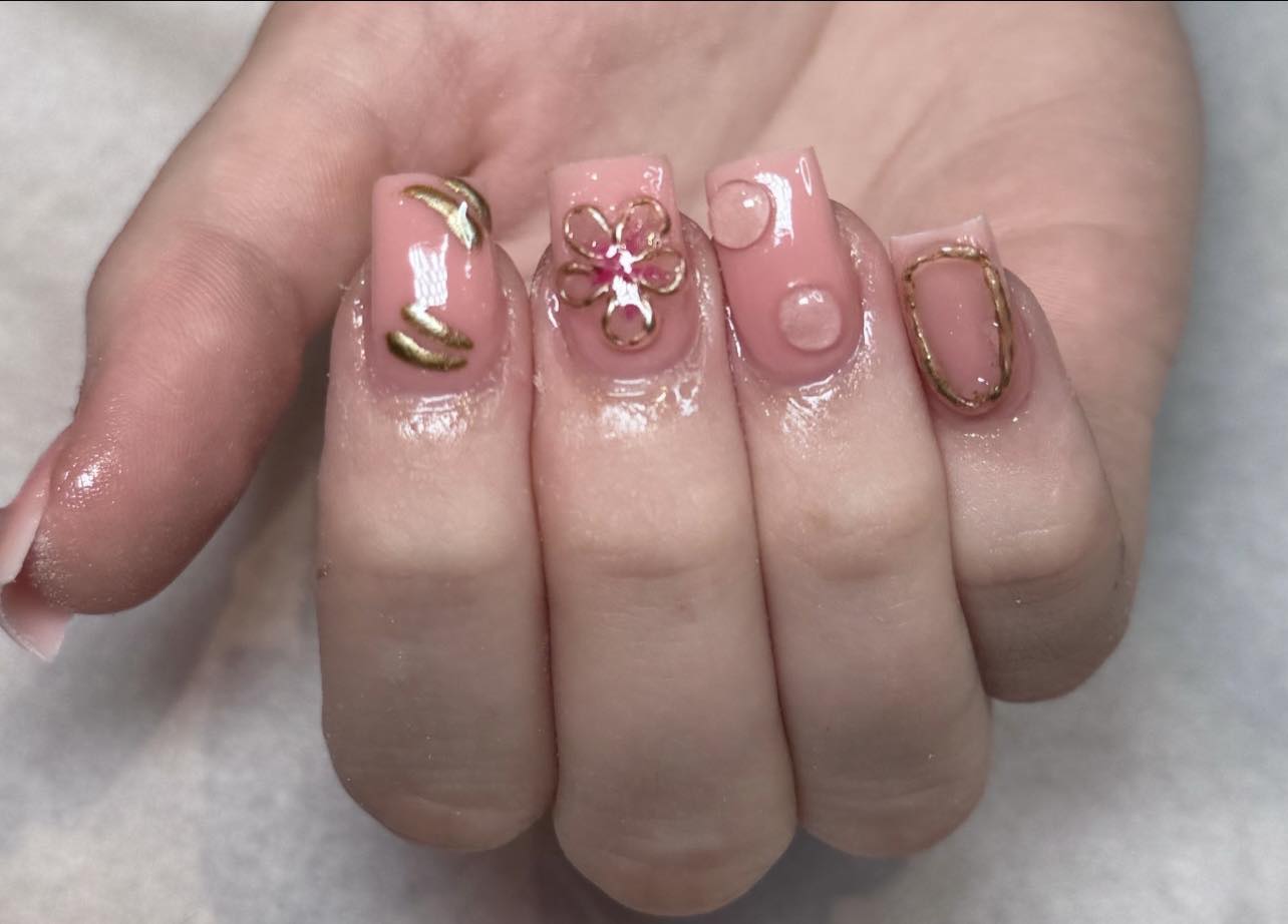Gold wire-art nail design at Chic